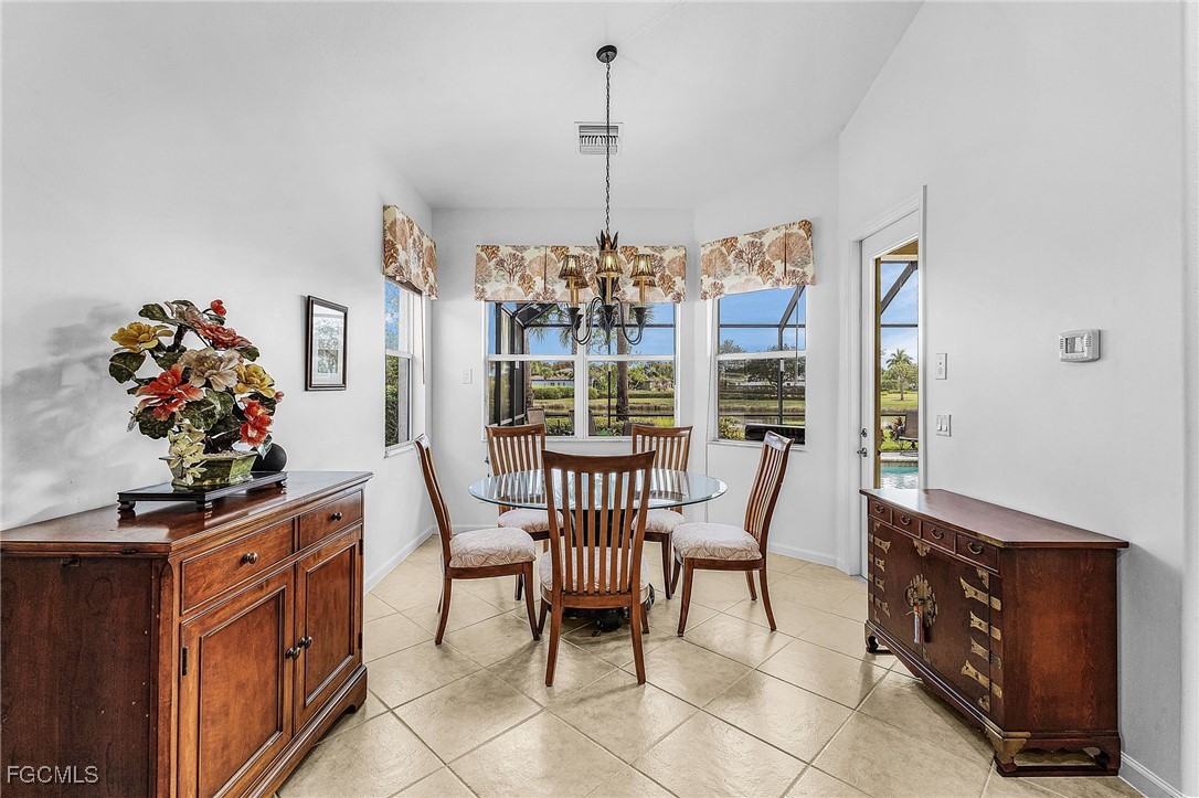 3900 Lakeview Isle Court Fort Myers, FL 33905 - Photo 9 of 31 a view of a dining room with furniture window and outdoor view
