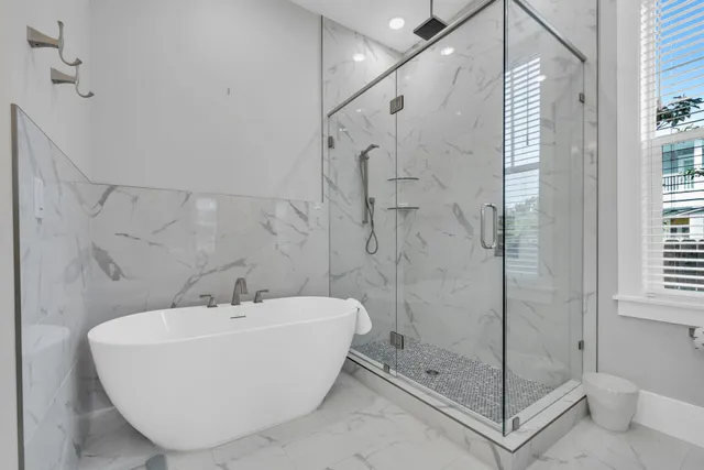 a dining room with wooden floor a chandelier a wooden table and chairs