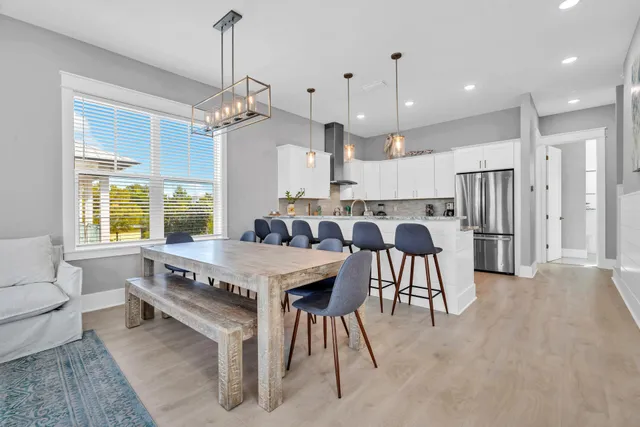 a bathroom with a double vanity sink toilet and shower