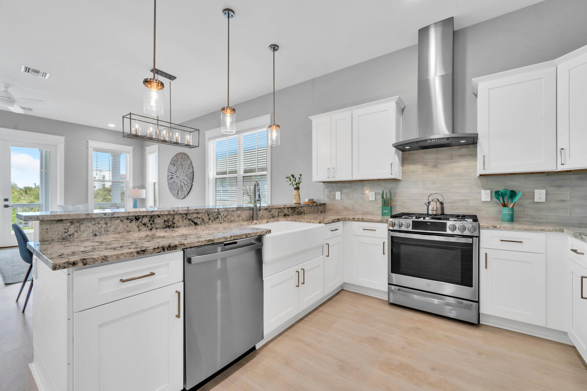 50 West Blue Crab Loop Inlet Beach, FL 32461 - Photo 28 of 67 a kitchen with stainless steel appliances granite countertop a sink stove and refrigerator