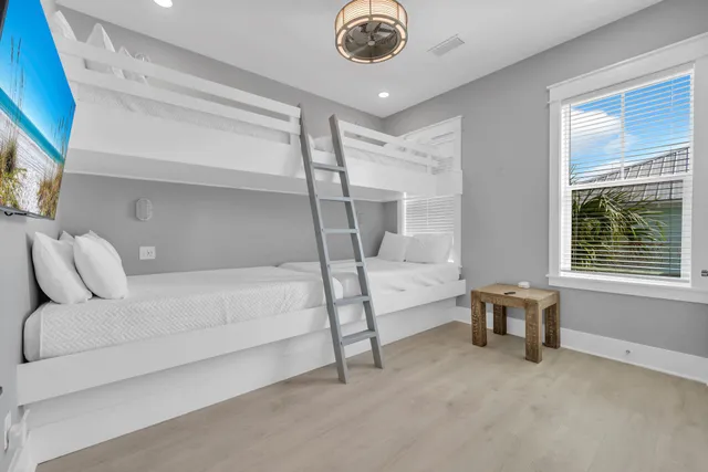 a living room with furniture a air conditioner and a window