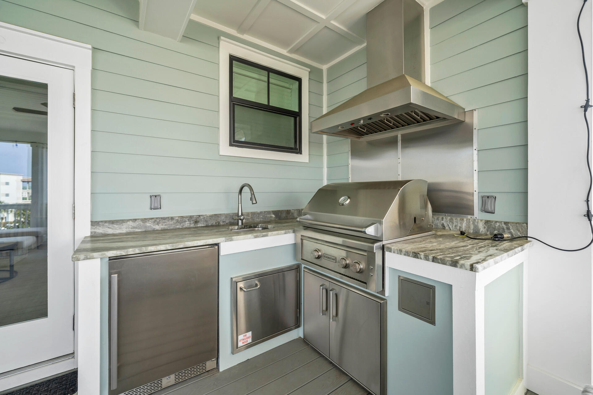 50 West Blue Crab Loop Inlet Beach, FL 32461 - Photo 41 of 67 a kitchen with stainless steel appliances granite countertop a stove and a sink