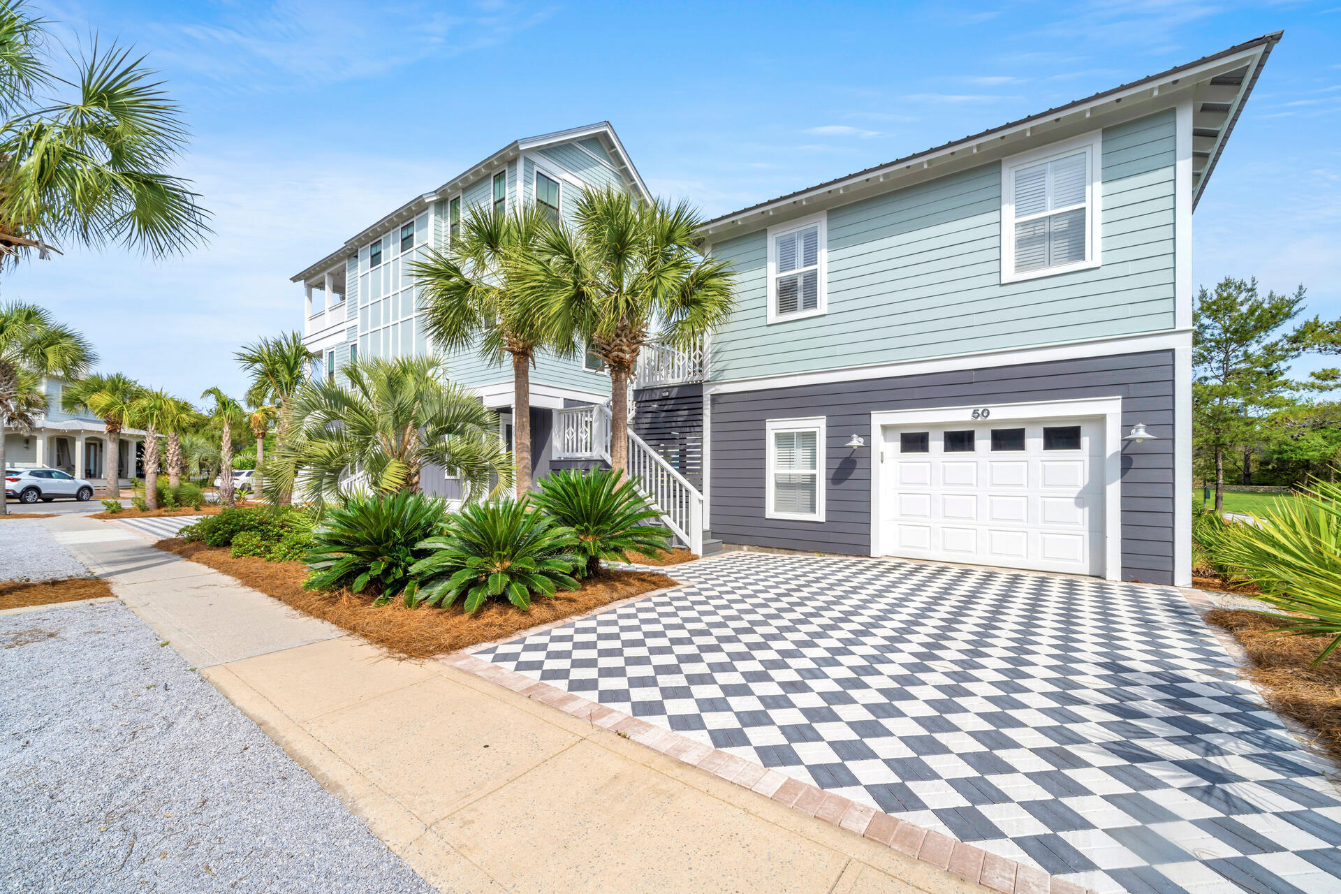 50 West Blue Crab Loop Inlet Beach, FL 32461 - Photo 7 of 67 a front view of a house with a yard and potted plants