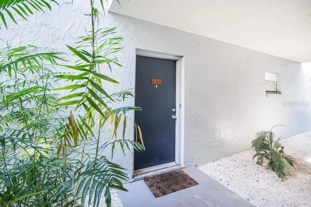 a view of an empty room and a window