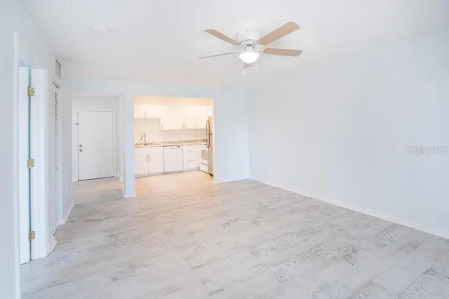 a view of an empty room with a window