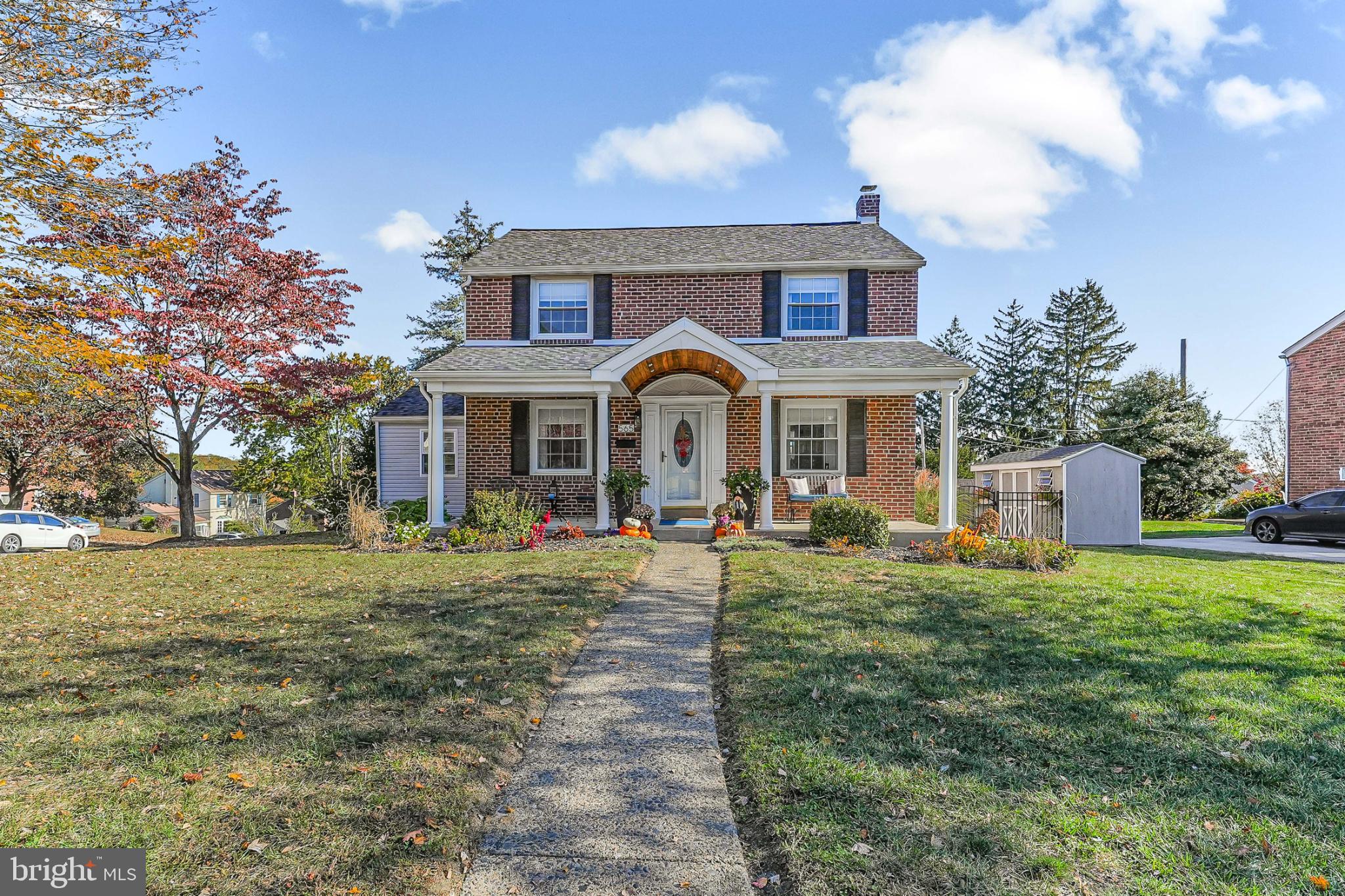 565 Kirk Road Springfield, PA 19064 - Photo 1 of 41 a front view of a house with yard and green space
