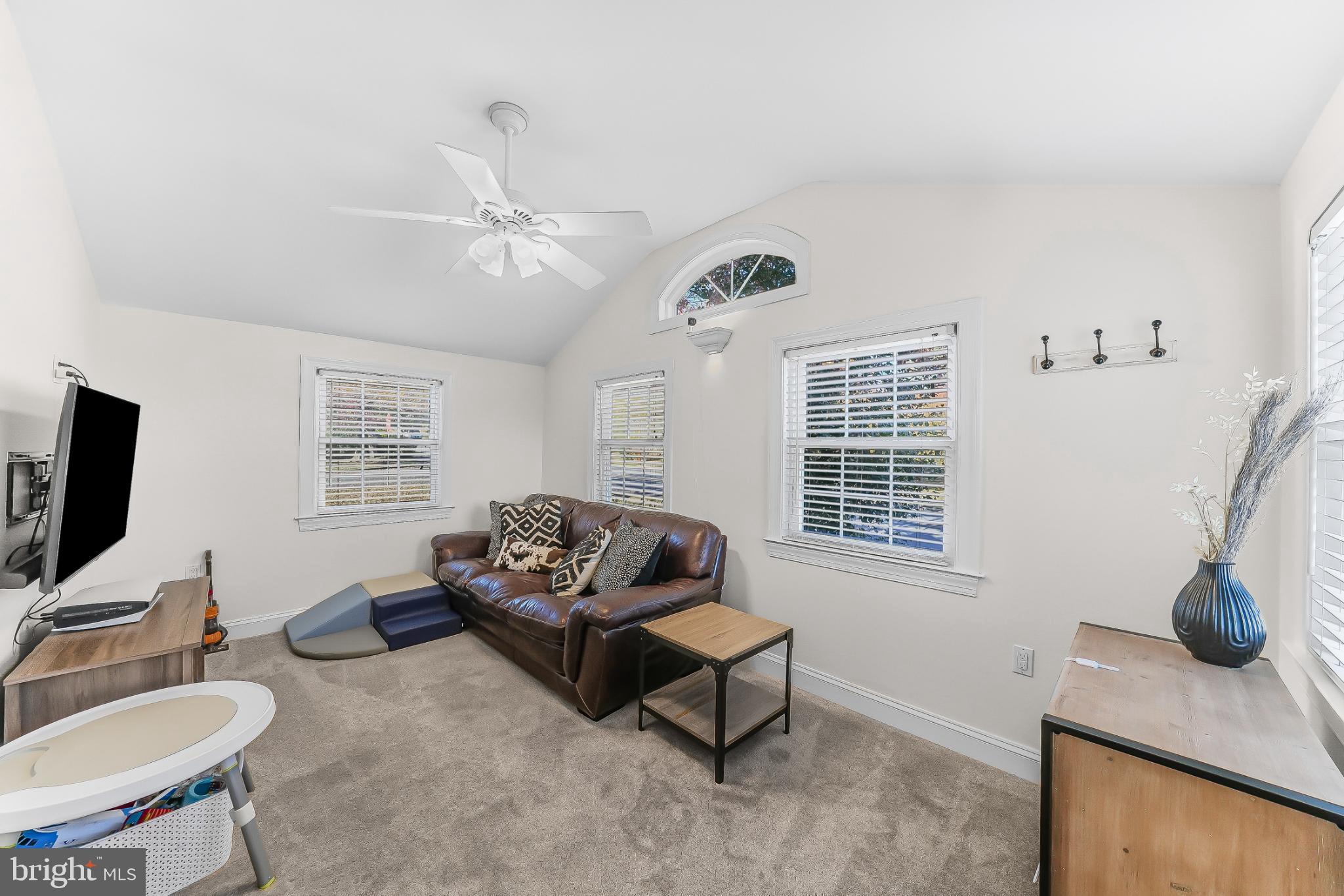 565 Kirk Road Springfield, PA 19064 - Photo 15 of 41 a living room with furniture and a flat screen tv