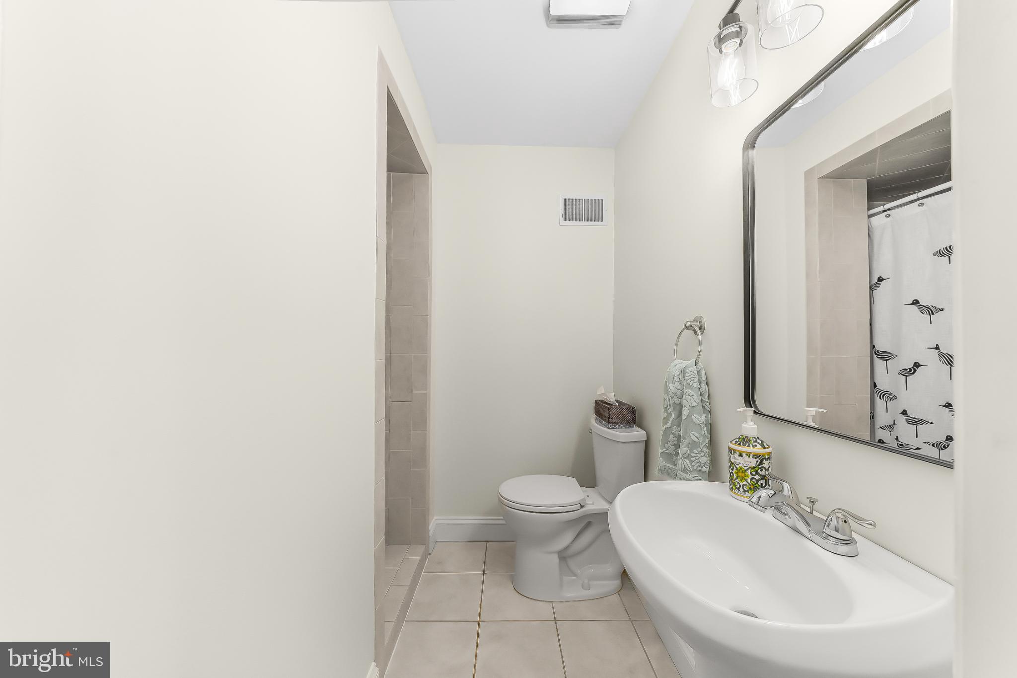 565 Kirk Road Springfield, PA 19064 - Photo 17 of 41 a bathroom with a sink and a toilet