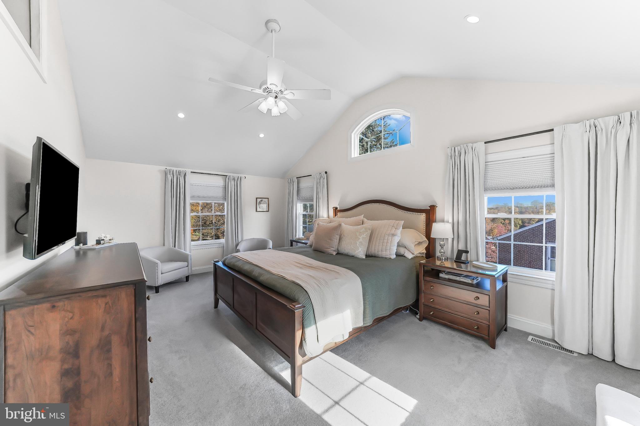 565 Kirk Road Springfield, PA 19064 - Photo 18 of 41 a bedroom with a bed and a flat tv screen on dresser