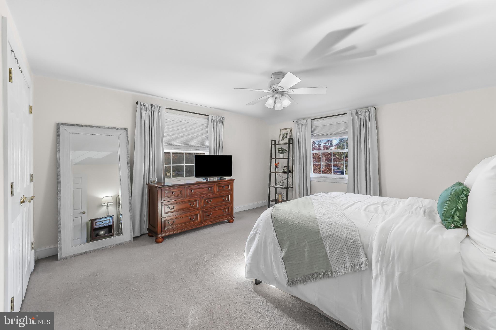 565 Kirk Road Springfield, PA 19064 - Photo 21 of 41 a bedroom with a bed and a flat screen tv