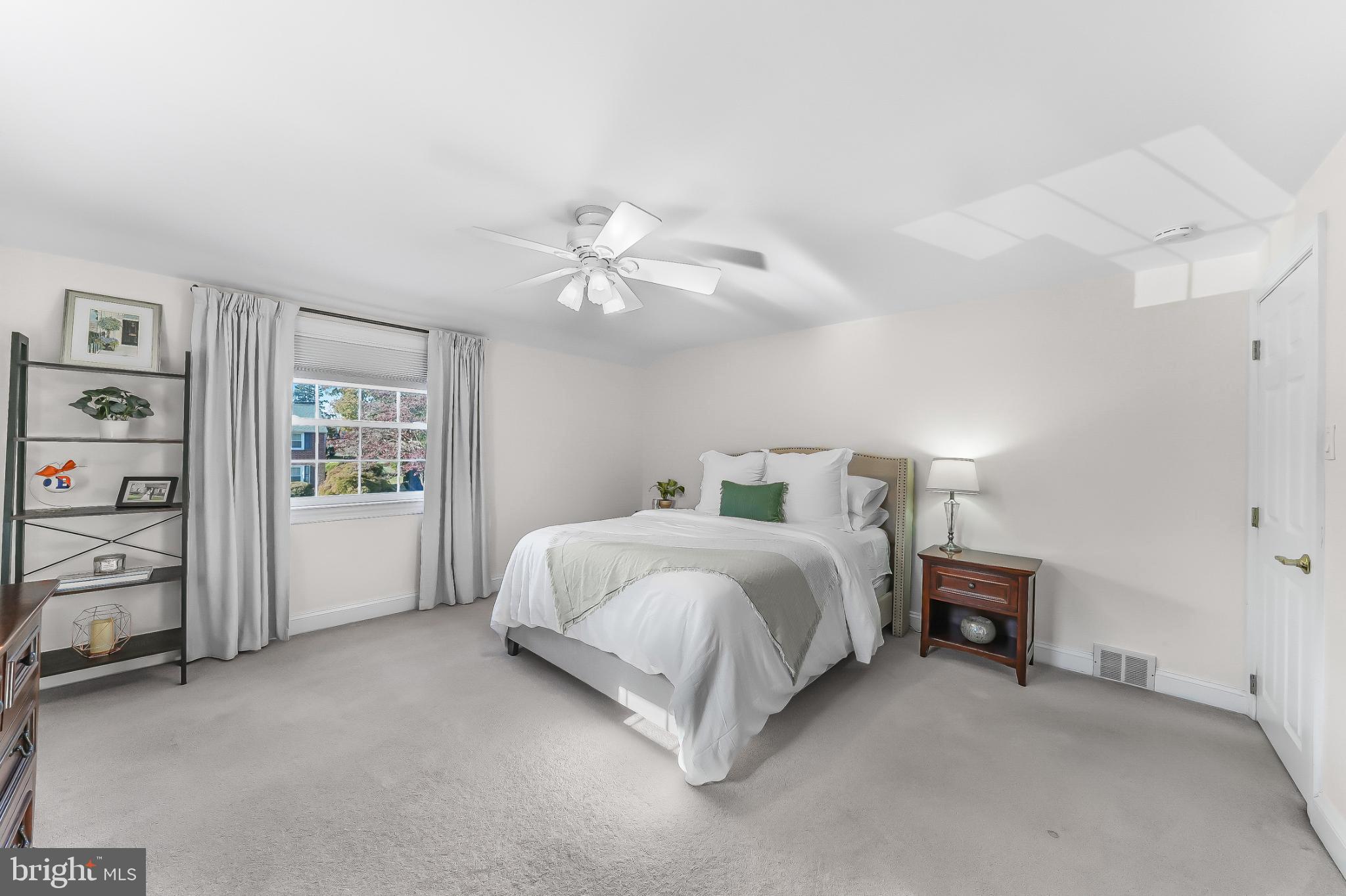 565 Kirk Road Springfield, PA 19064 - Photo 22 of 41 a bed room with a bed and a lamp