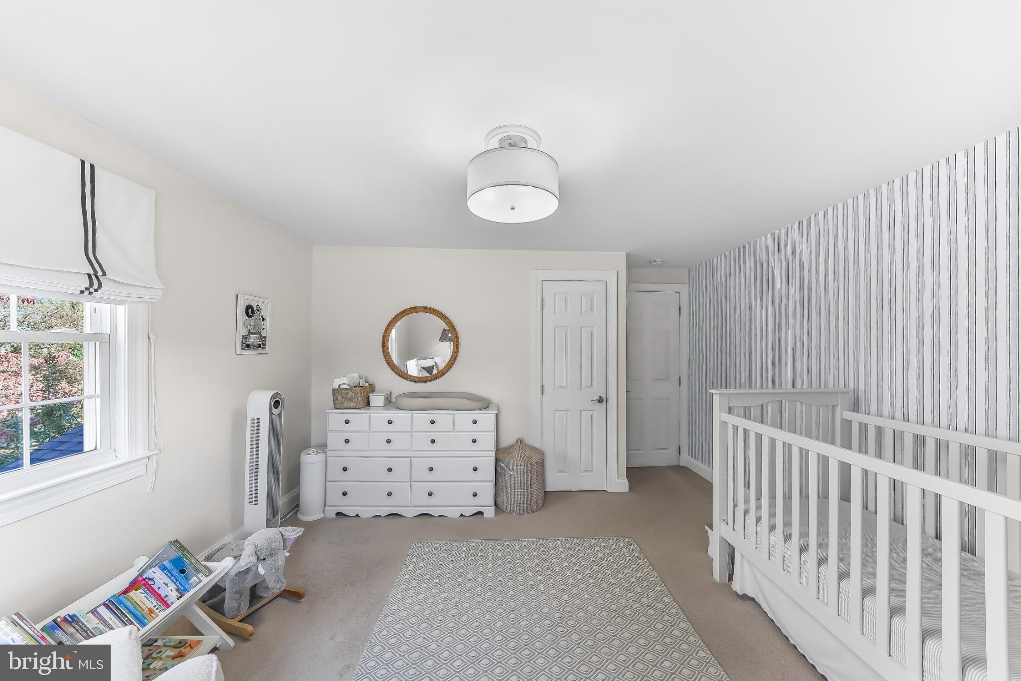 565 Kirk Road Springfield, PA 19064 - Photo 25 of 41 a bedroom with a bed and a window