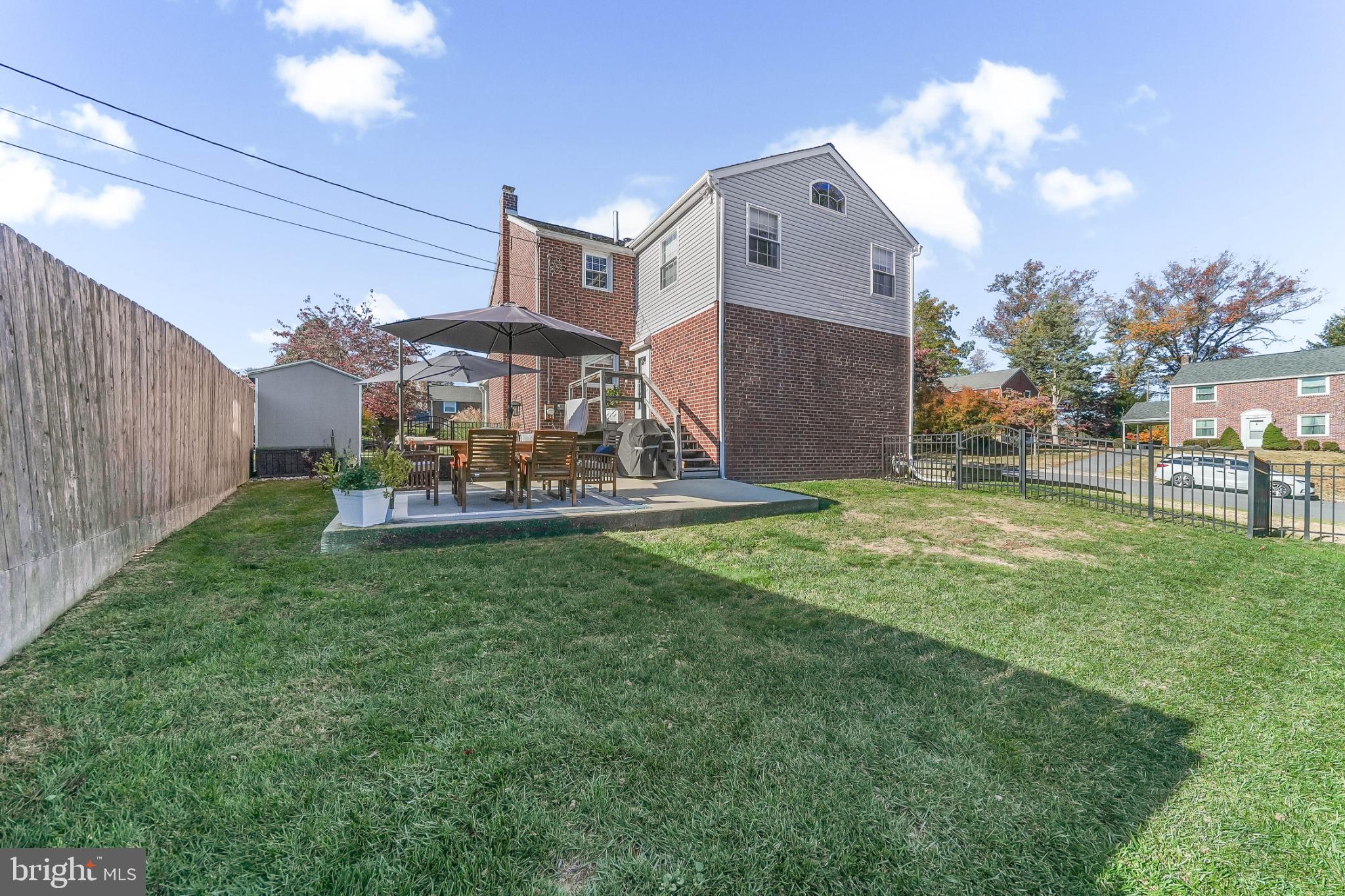 565 Kirk Road Springfield, PA 19064 - Photo 32 of 41 a view of a house with a big yard potted plants and large tree