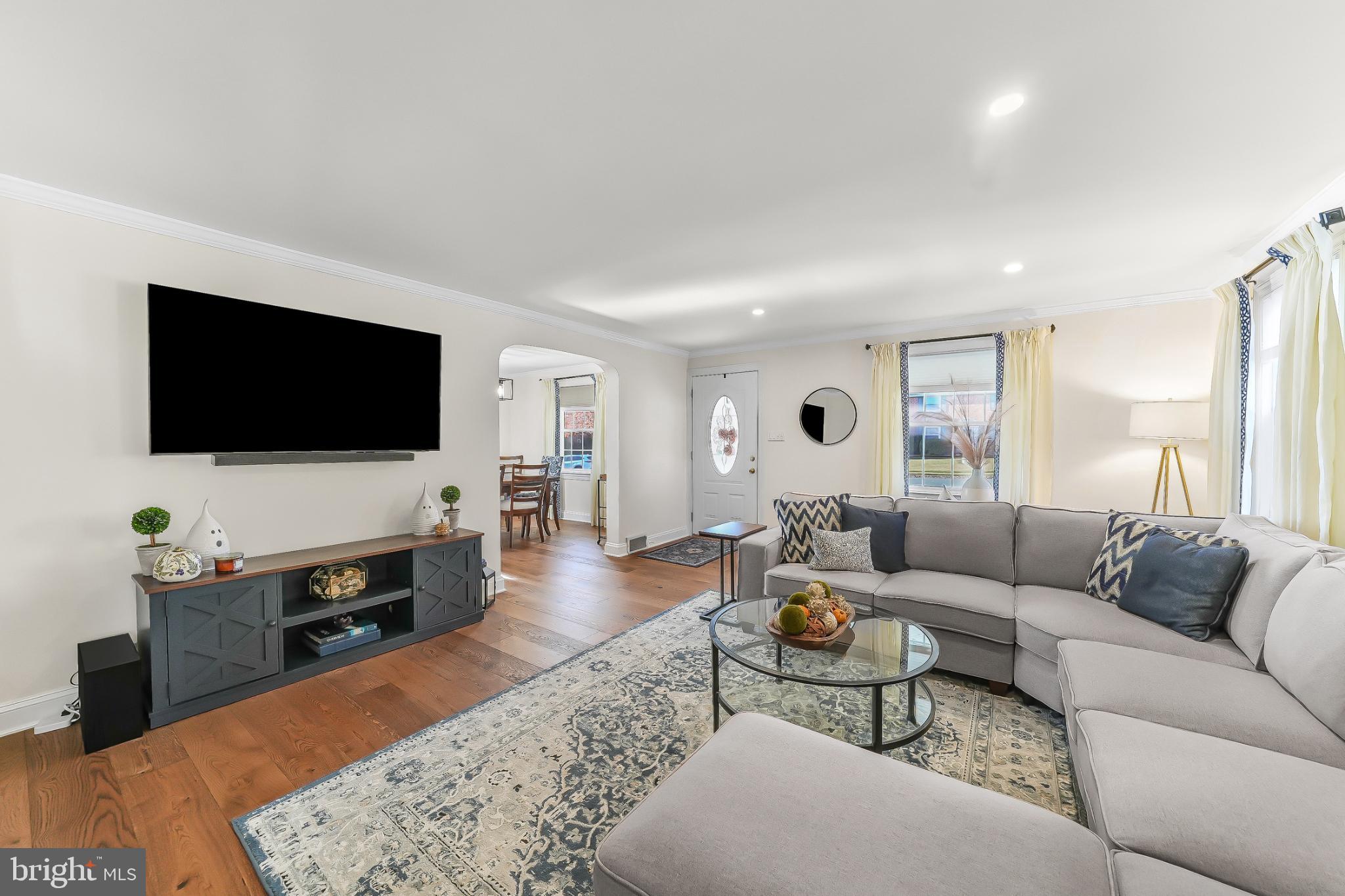565 Kirk Road Springfield, PA 19064 - Photo 9 of 41 a living room with furniture and a flat screen tv