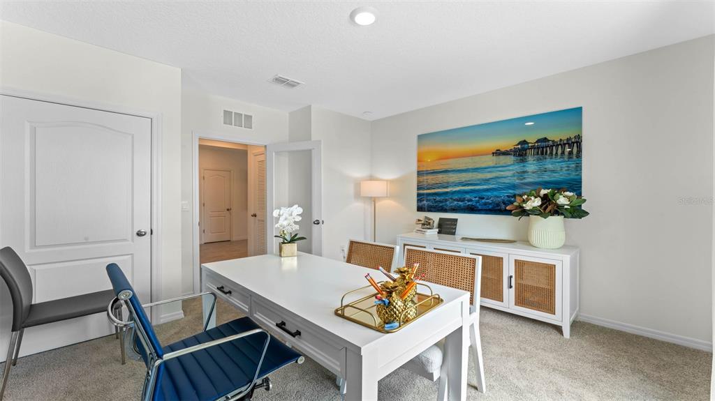 5224 Masser Road St. Cloud, FL 34772 - Photo 9 of 18 a view of a dining room with furniture and wooden floor
