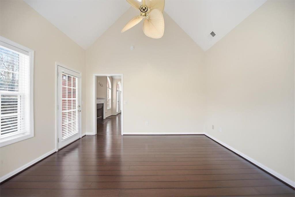 111 Stonegate Lane Canton, GA 30114 - Photo 11 of 30 a view of an empty room with wooden floor and a window