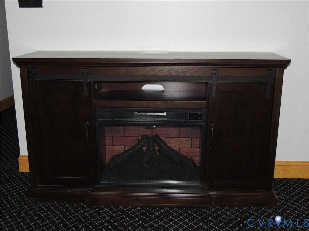 12512 Cox Road Church Road, VA 23833 - Photo 39 of 42 Dark wood-finish electric fireplace in bonus room