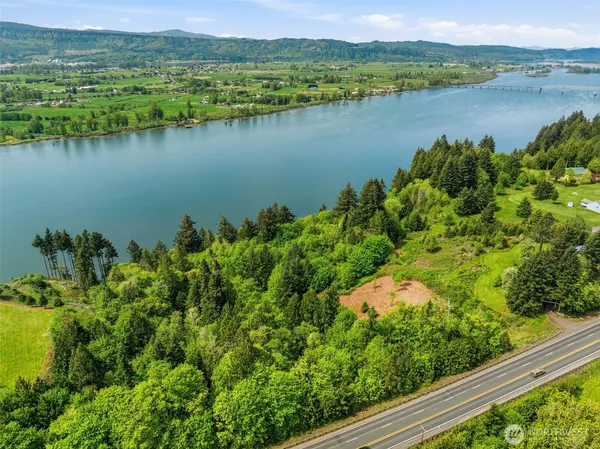a view of a lake with houses in the back