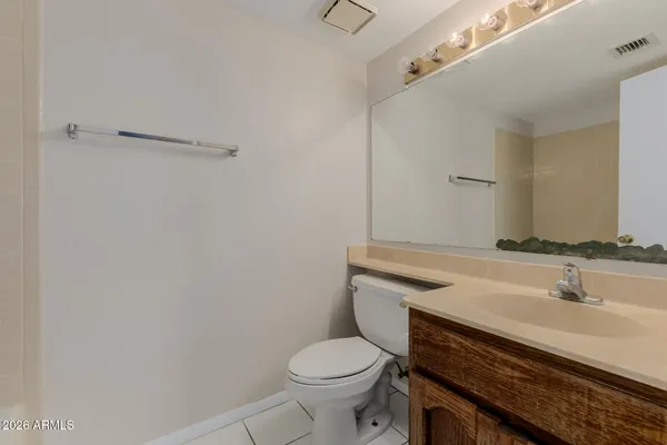 a bathroom with a sink toilet and vanity