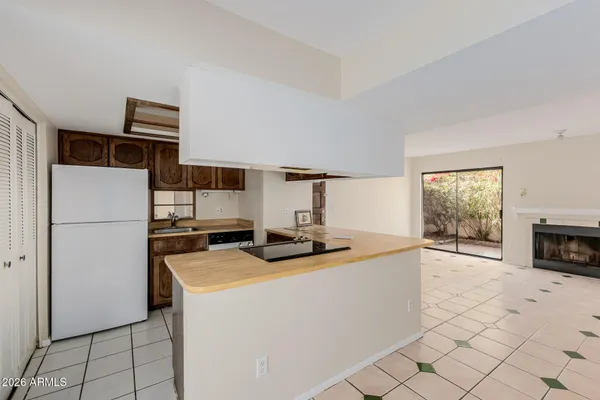 a kitchen with a stove and a refrigerator