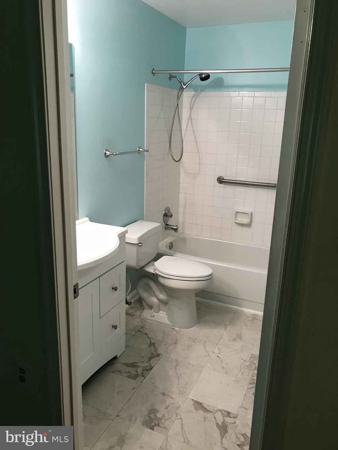 974 Riversedge Circle Annapolis, MD 21401 - Photo 6 of 9 a bathroom with a granite countertop sink toilet and shower