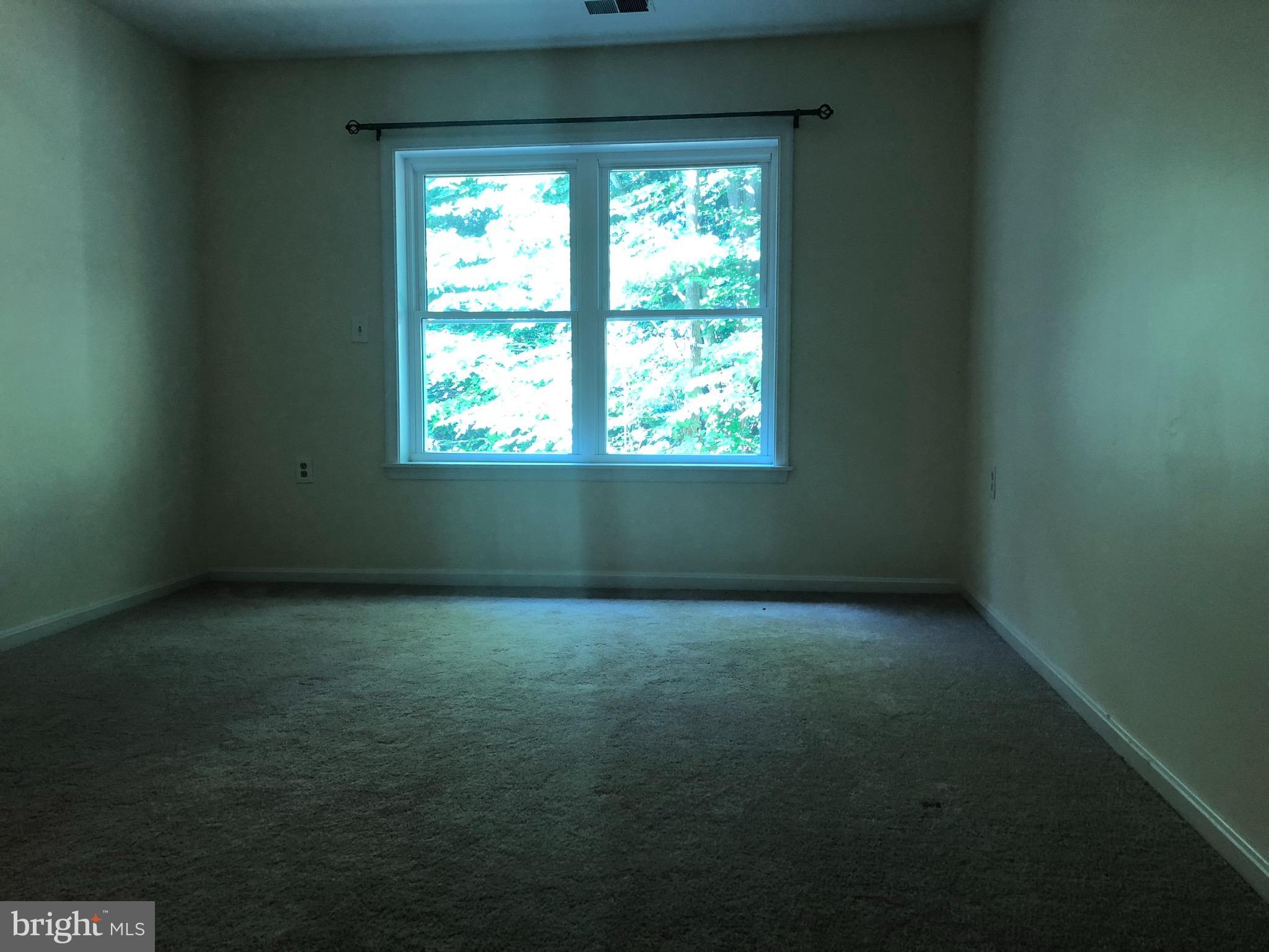 974 Riversedge Circle Annapolis, MD 21401 - Photo 7 of 9 a view of an empty room and window