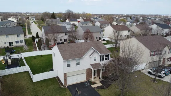 an aerial view of a house with swimming pool