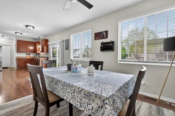 a dining room with furniture and window