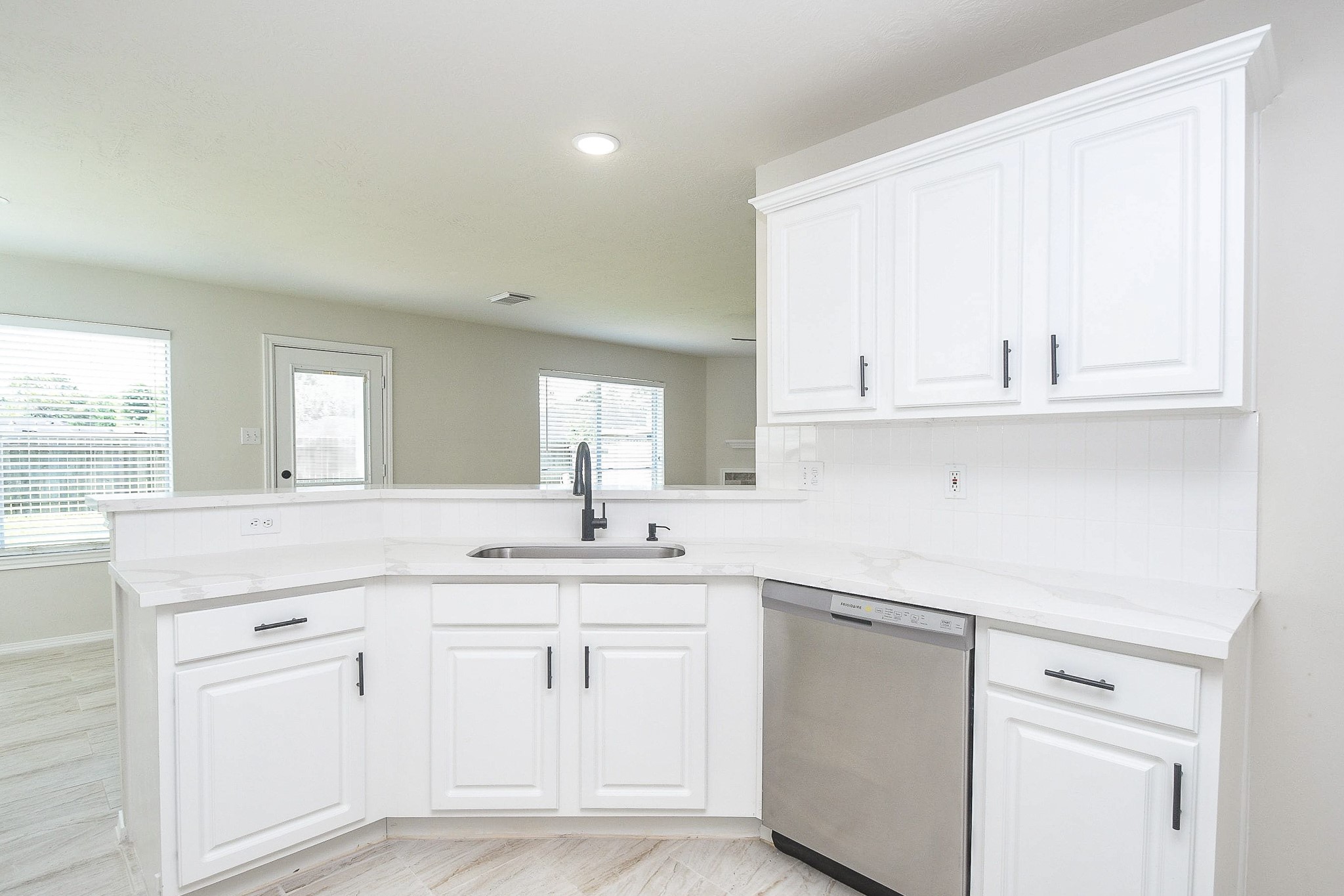 4810 Arbor Court Rosenberg, TX 77471 - Photo 6 of 20 a kitchen with white cabinets and sink
