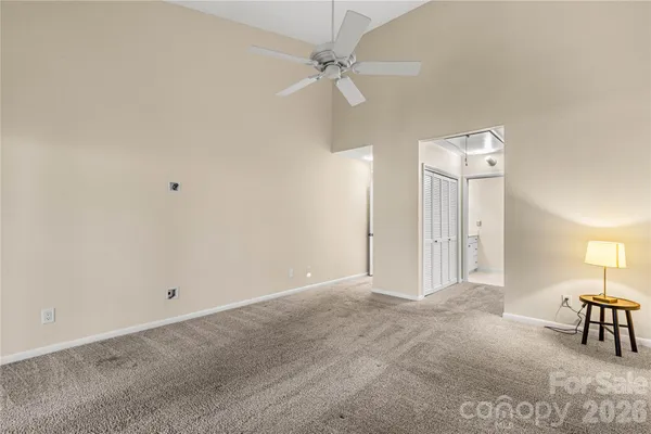 a view of a patio with dining table and chairs with wooden floor and fence