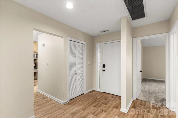 a kitchen with stainless steel appliances granite countertop a stove microwave and cabinets