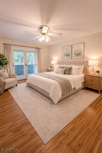27 Espy Road, Unit A7 Caldwell, NJ 07006 - Photo 13 of 29 a spacious bedroom with a large bed and a chandelier