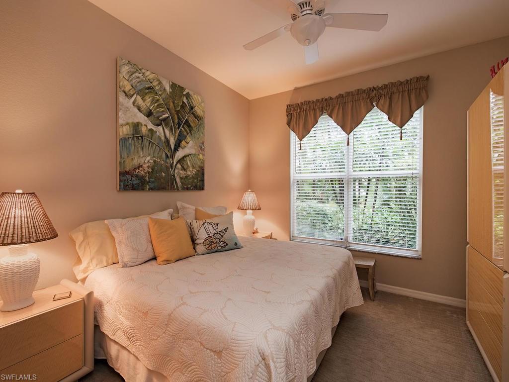 3220 Hamlet Drive, Unit 2 Naples, FL 34105 - Photo 11 of 17 a bedroom with a bed and a window