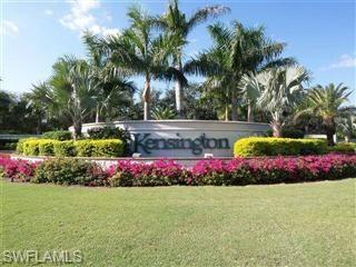 3220 Hamlet Drive, Unit 2 Naples, FL 34105 - Photo 14 of 17 a view of a garden with flowers and swimming pool