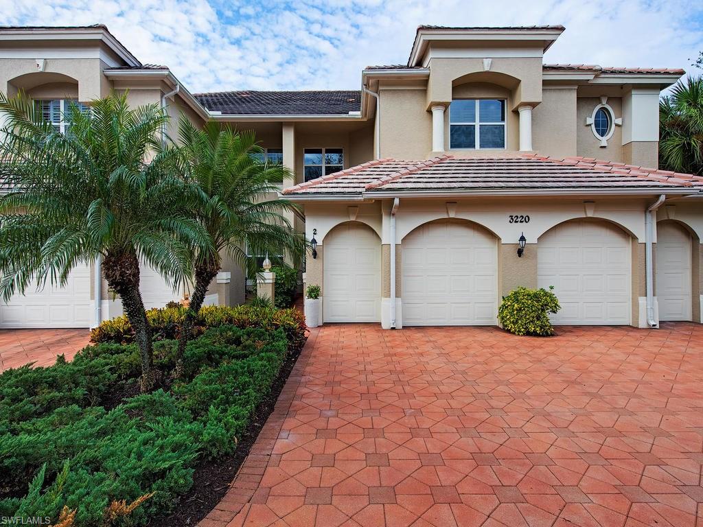 3220 Hamlet Drive, Unit 2 Naples, FL 34105 - Photo 2 of 17 a front view of a house with garden