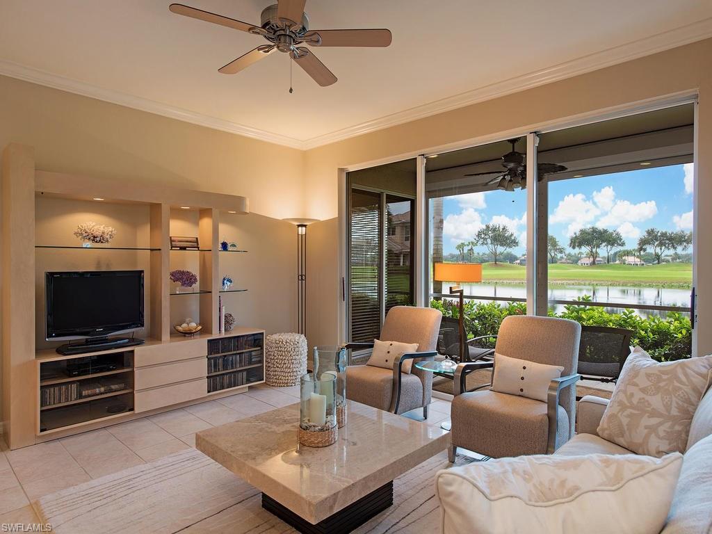 3220 Hamlet Drive, Unit 2 Naples, FL 34105 - Photo 3 of 17 a living room with furniture and a flat screen tv
