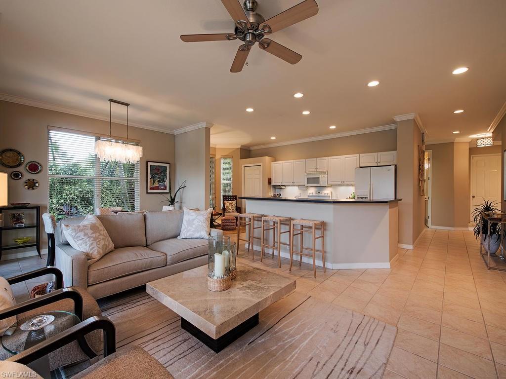 3220 Hamlet Drive, Unit 2 Naples, FL 34105 - Photo 5 of 17 a living room with furniture and a large window