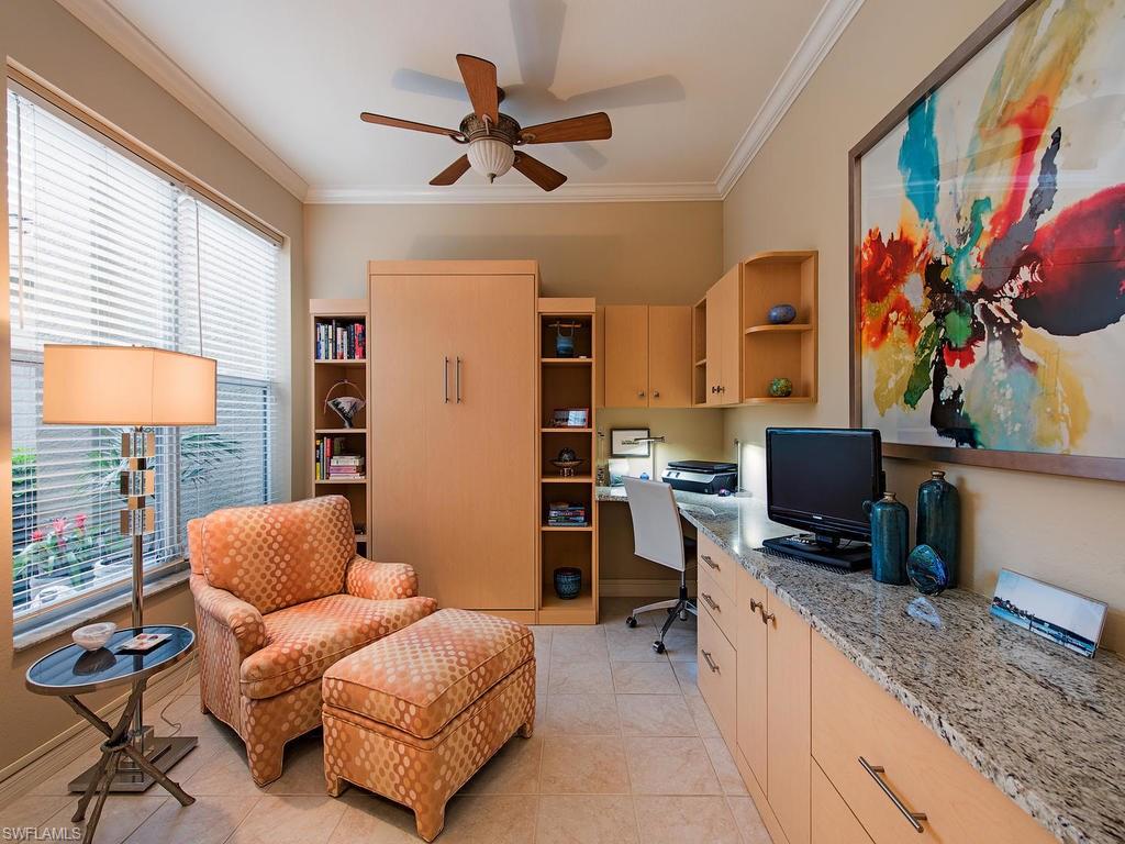 3220 Hamlet Drive, Unit 2 Naples, FL 34105 - Photo 6 of 17 a living room with furniture and a flat screen tv