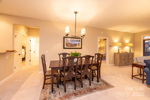 a kitchen with stainless steel appliances granite countertop a stove refrigerator and a sink