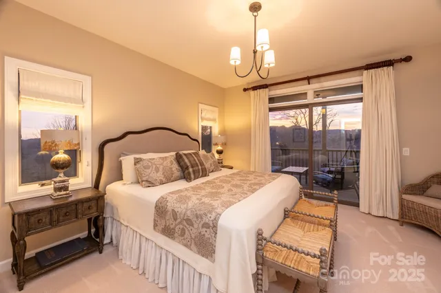 a bedroom with a bed and a table with chair