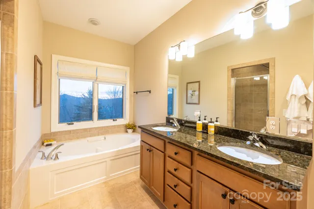 a spacious bedroom with a bed and a large window