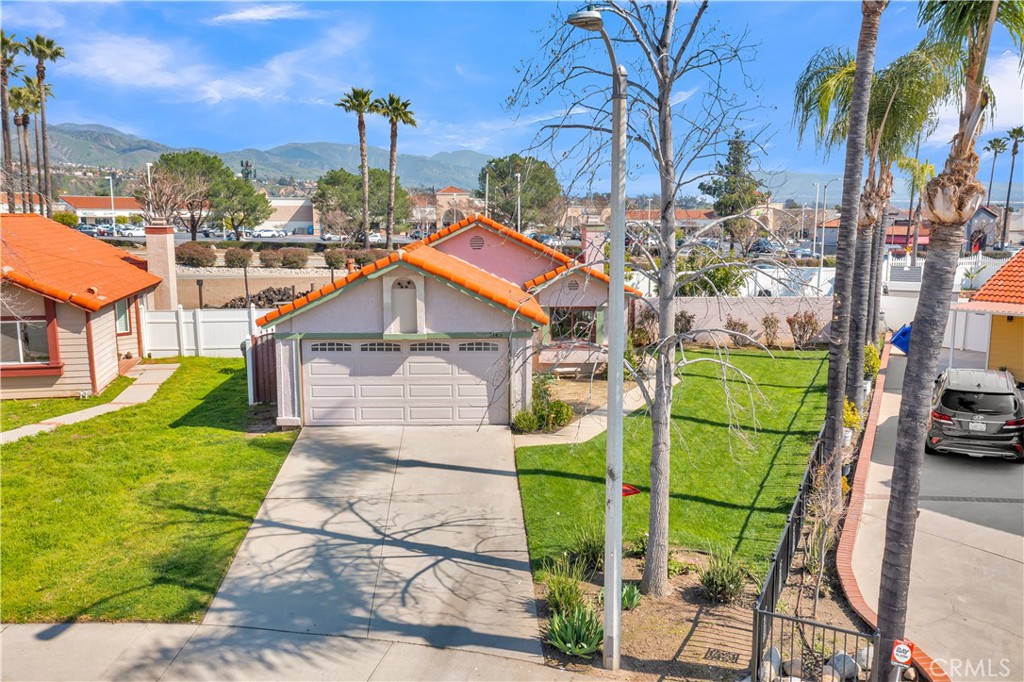 7143 Devon Avenue Highland, CA 92346 - Photo 1 of 1 a front view of a house with a garden