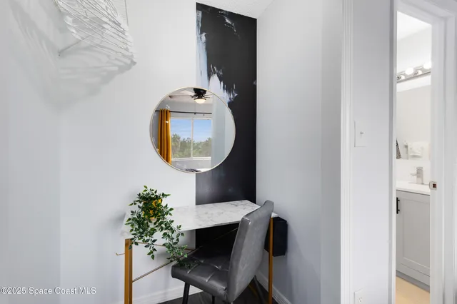 a room with furniture and a mirror