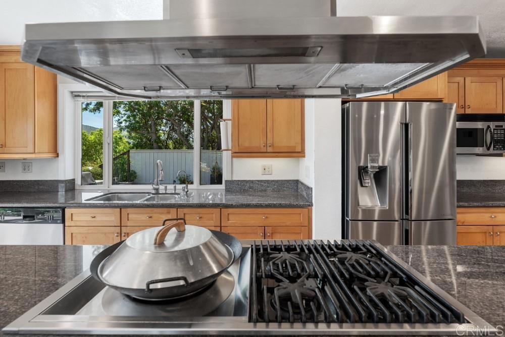 14040 Old Station Road Poway, CA 92064 - Photo 13 of 53 a kitchen with a stove and a refrigerator