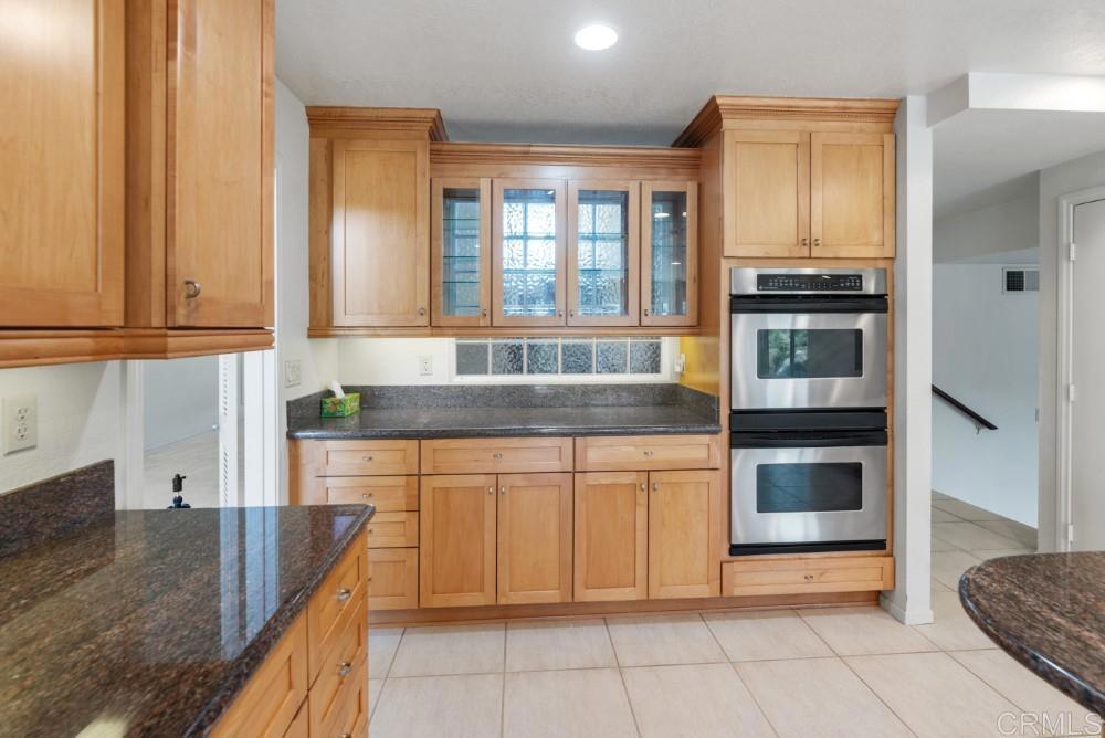 14040 Old Station Road Poway, CA 92064 - Photo 16 of 53 a kitchen with stainless steel appliances granite countertop a refrigerator and a sink