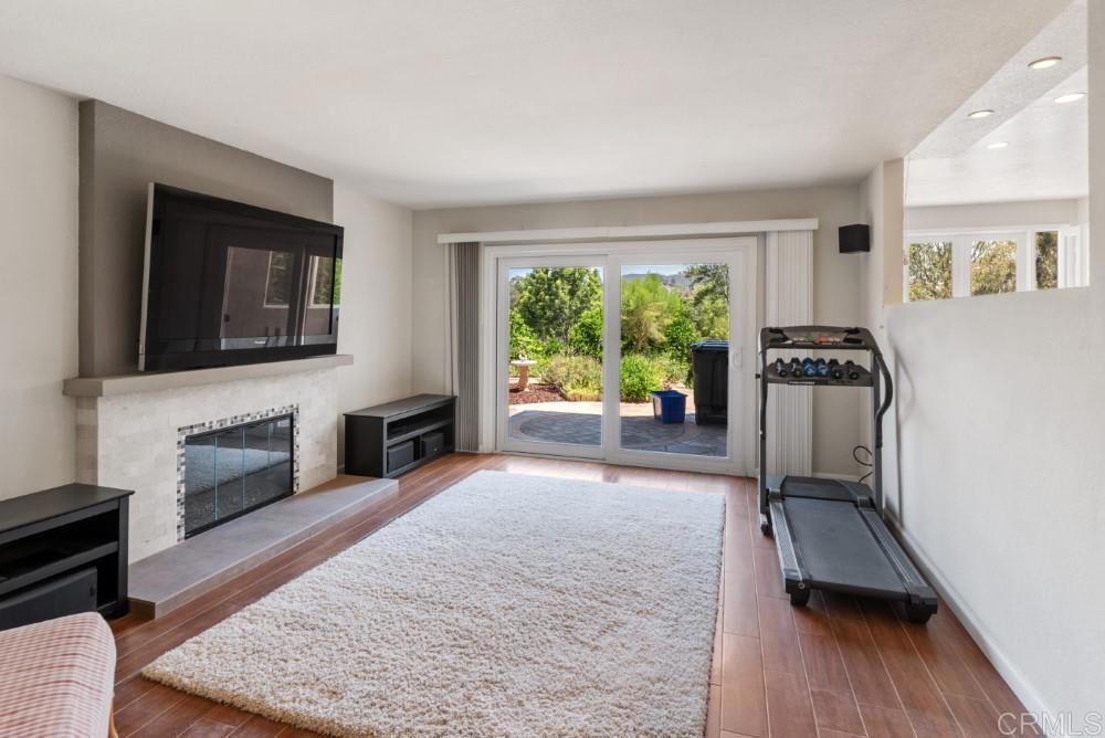 14040 Old Station Road Poway, CA 92064 - Photo 18 of 53 a living room with furniture fireplace and flat screen tv