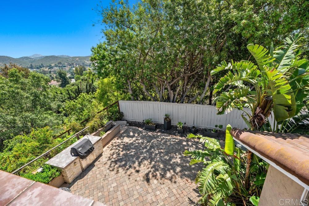 14040 Old Station Road Poway, CA 92064 - Photo 30 of 53 a view of a garden with a wooden fence