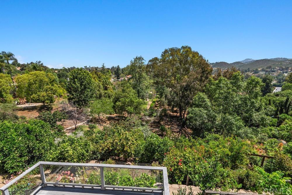 14040 Old Station Road Poway, CA 92064 - Photo 31 of 53 a view of a yard with a tree in the background