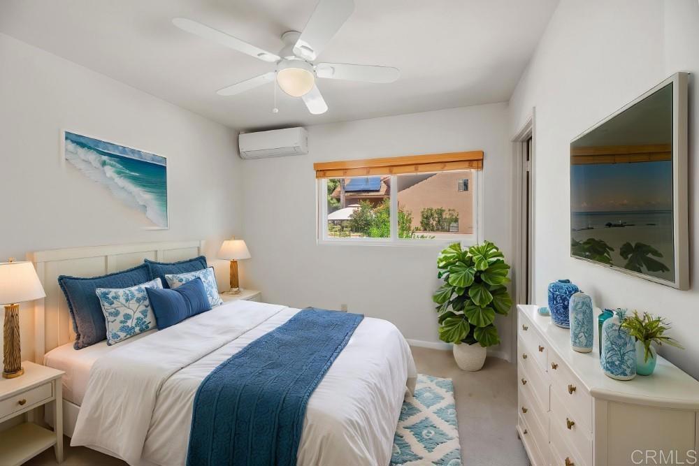 14040 Old Station Road Poway, CA 92064 - Photo 32 of 53 a bedroom with a bed and a potted plant