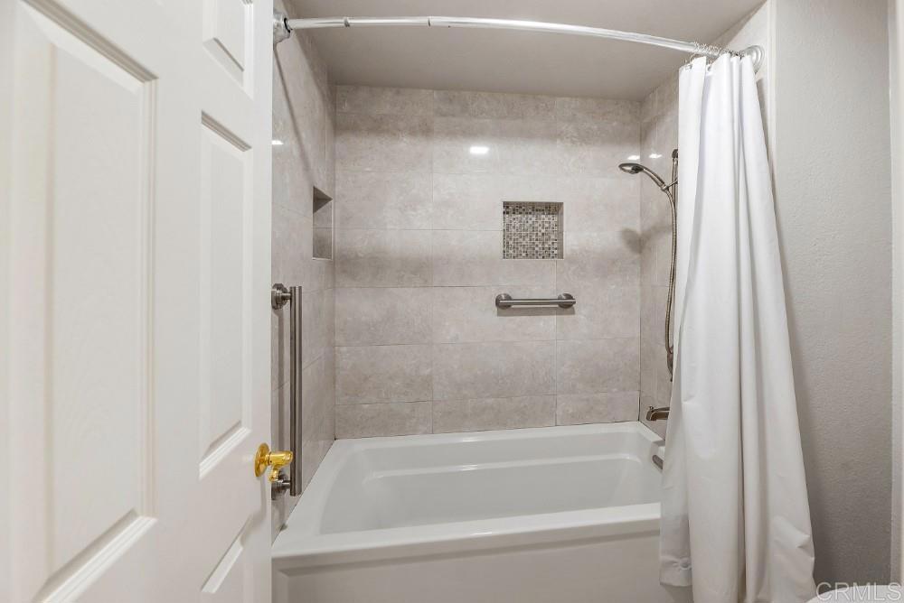 14040 Old Station Road Poway, CA 92064 - Photo 36 of 53 a bathroom with a bathtub and a shower